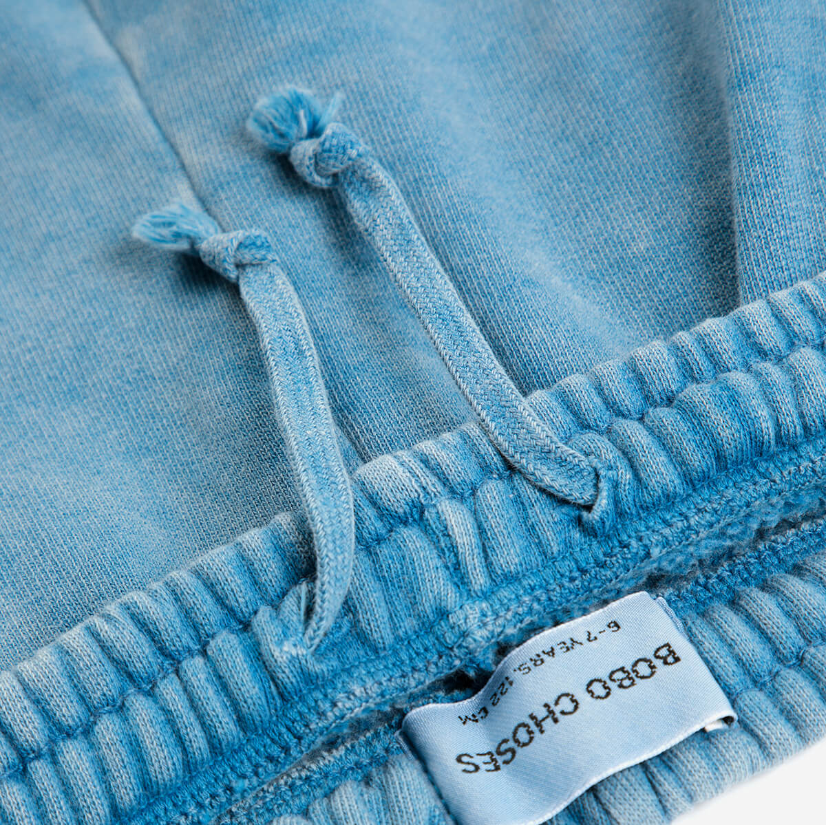 Pantalon de jogging décontracté en mélange de coton biologique avec motif graphique bleu, taille élastiquée et poches latérales pour enfants (1-13 ans)