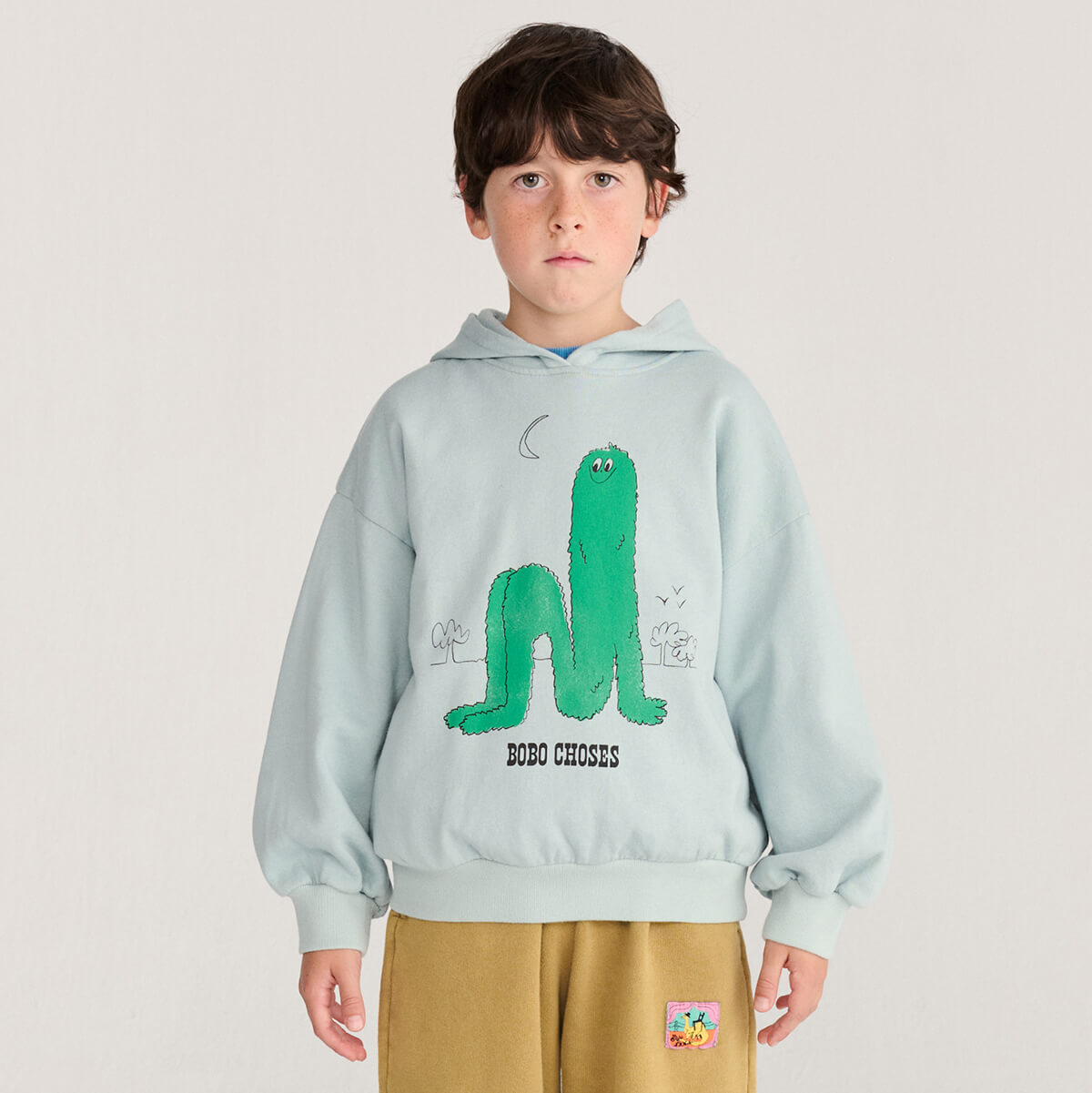 Sweat à capuche en coton bio imprimé bleu clair ludique à manches longues bouffantes avec poignets côtelés, conçu pour les enfants de 1 à 13 ans