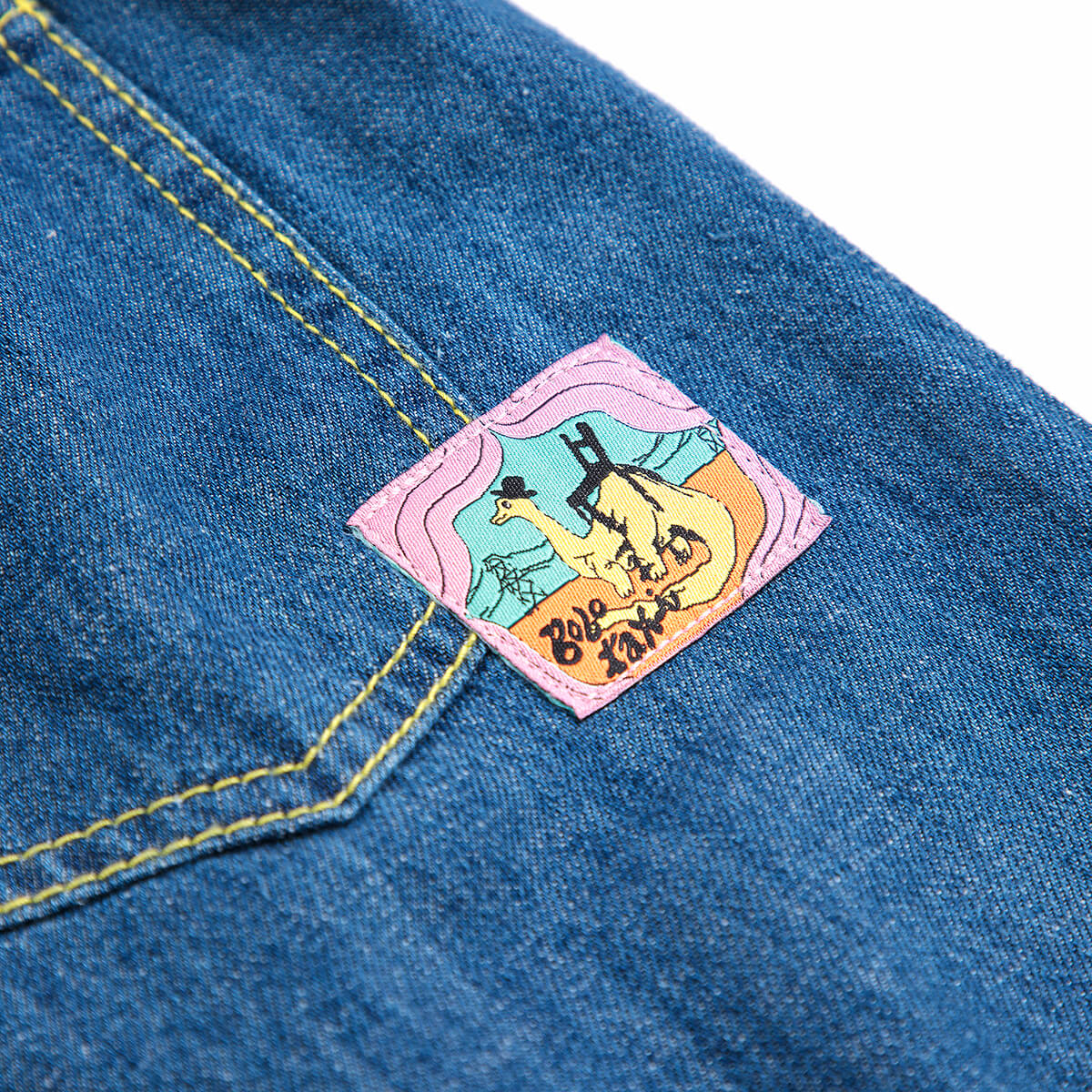 Pantalon en jean dinosaure bleu ludique avec motif graphique amusant pour les enfants (2-13 ans)