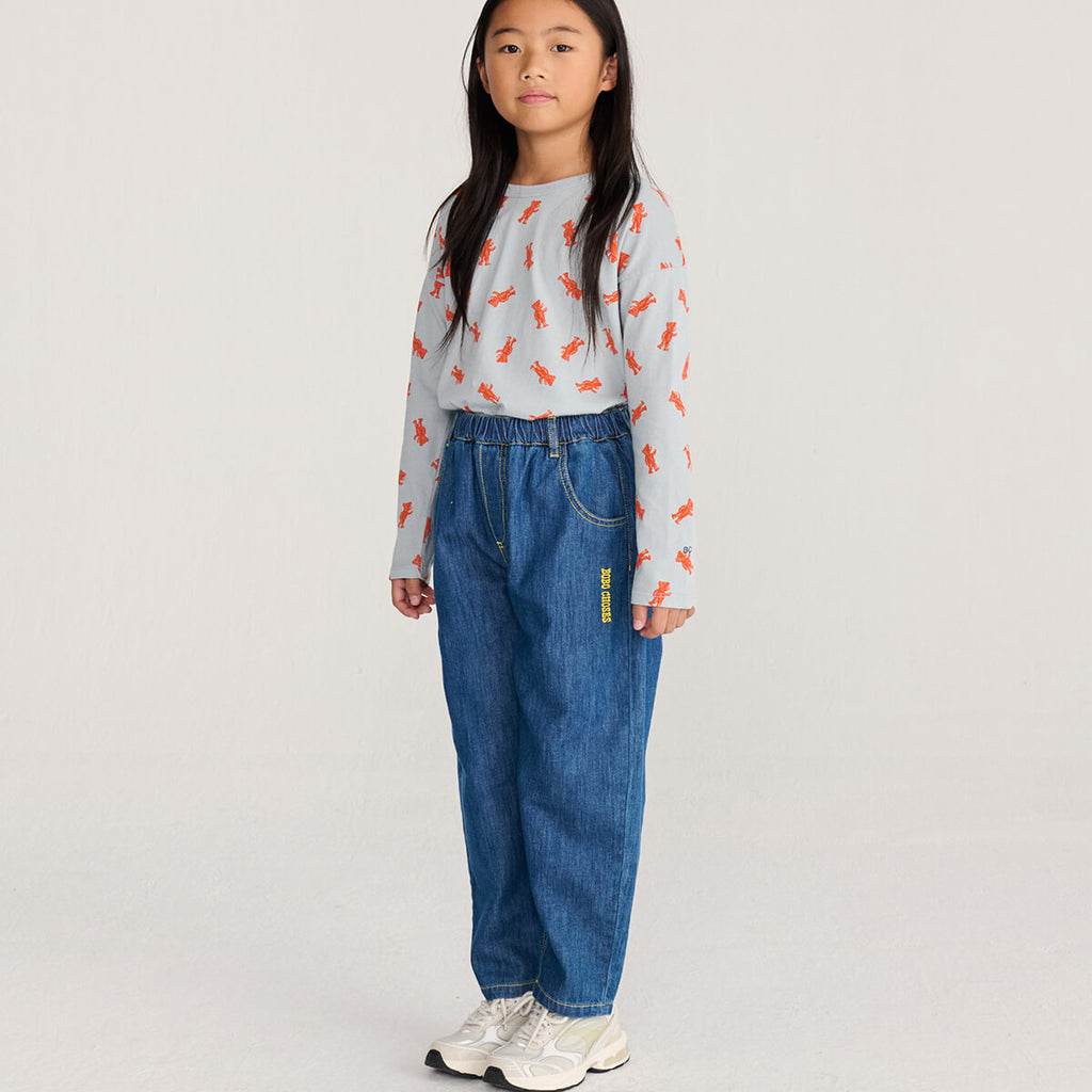 Pantalon en jean dinosaure bleu ludique avec motif graphique amusant pour les enfants (2-13 ans)